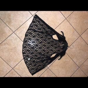 This is Tillys black lace vest